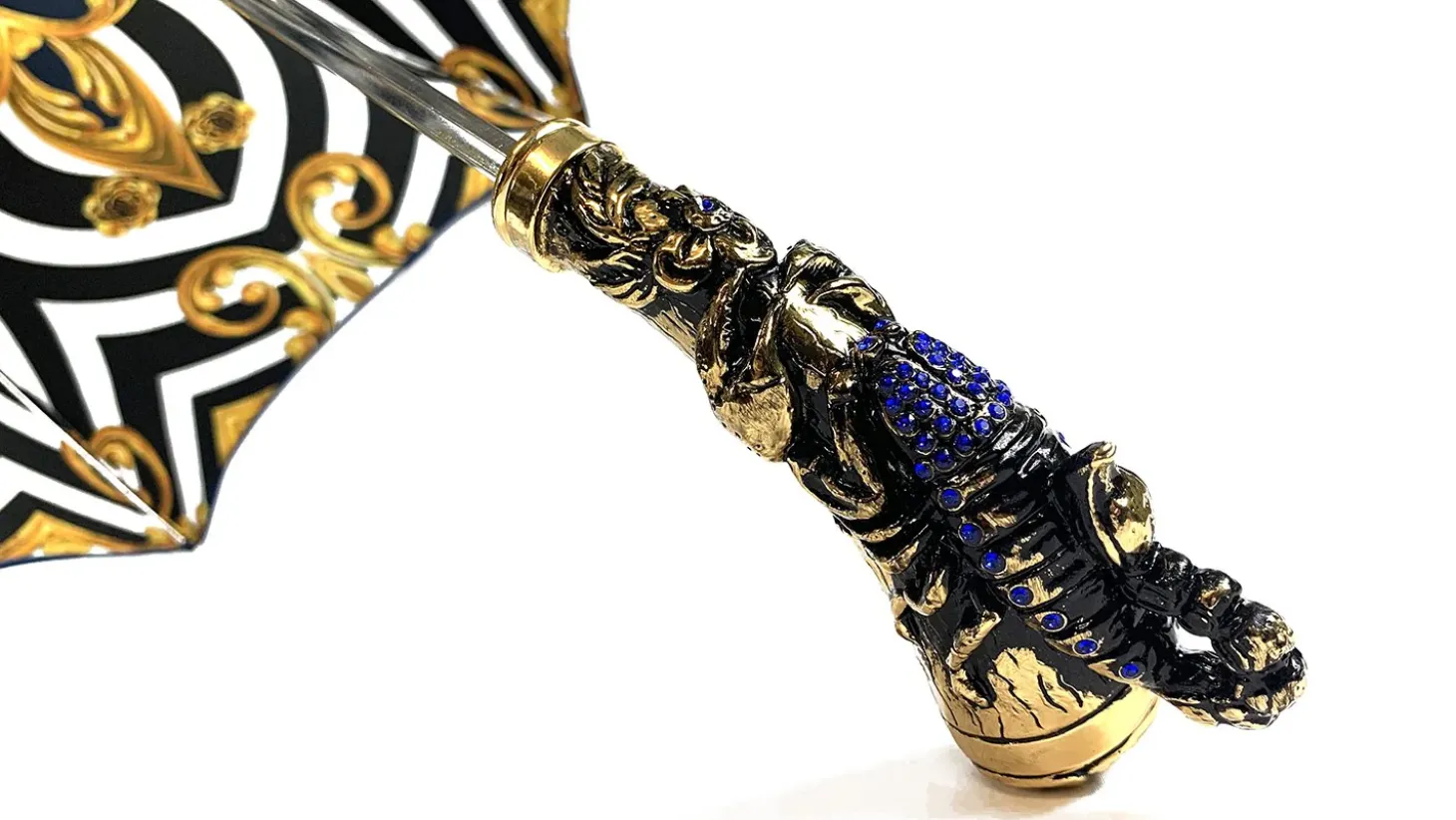Exclusive handle with 24K golden scorpion and embellished with sapphir