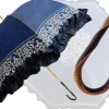 Women's umbrella Studied with a Black & White Pattern on a Blue Canopy